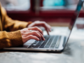 Closeup shot of an unrecognizable woman using laptop