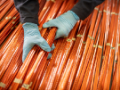 Electrical engineer inspecting copper windings in electrical engineering factory