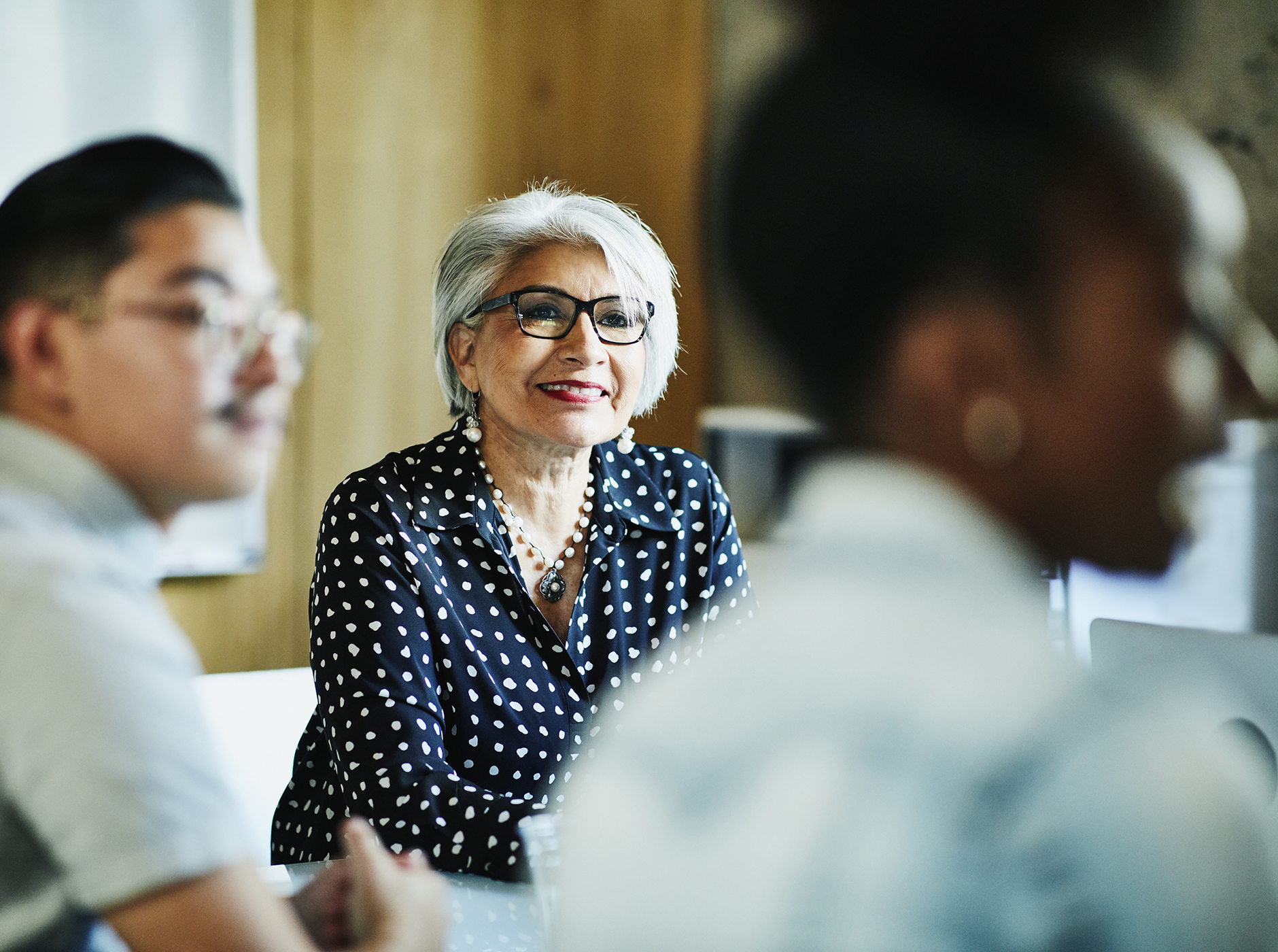 multi-generational business team in meeting