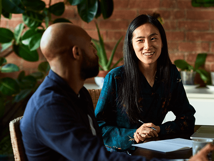 two people talking at a table