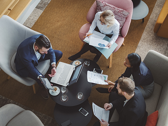 group of business people working in office cafeteria